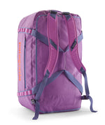 A close up of the Patagonia black hole 70L duffel bag in brisk purple available at Babipur showing the shoulder straps and carry straps detail