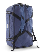 A close up of the Patagonia black hole 70L duffel bag in current blue available at Babipur showing the shoulder straps and carry straps detail