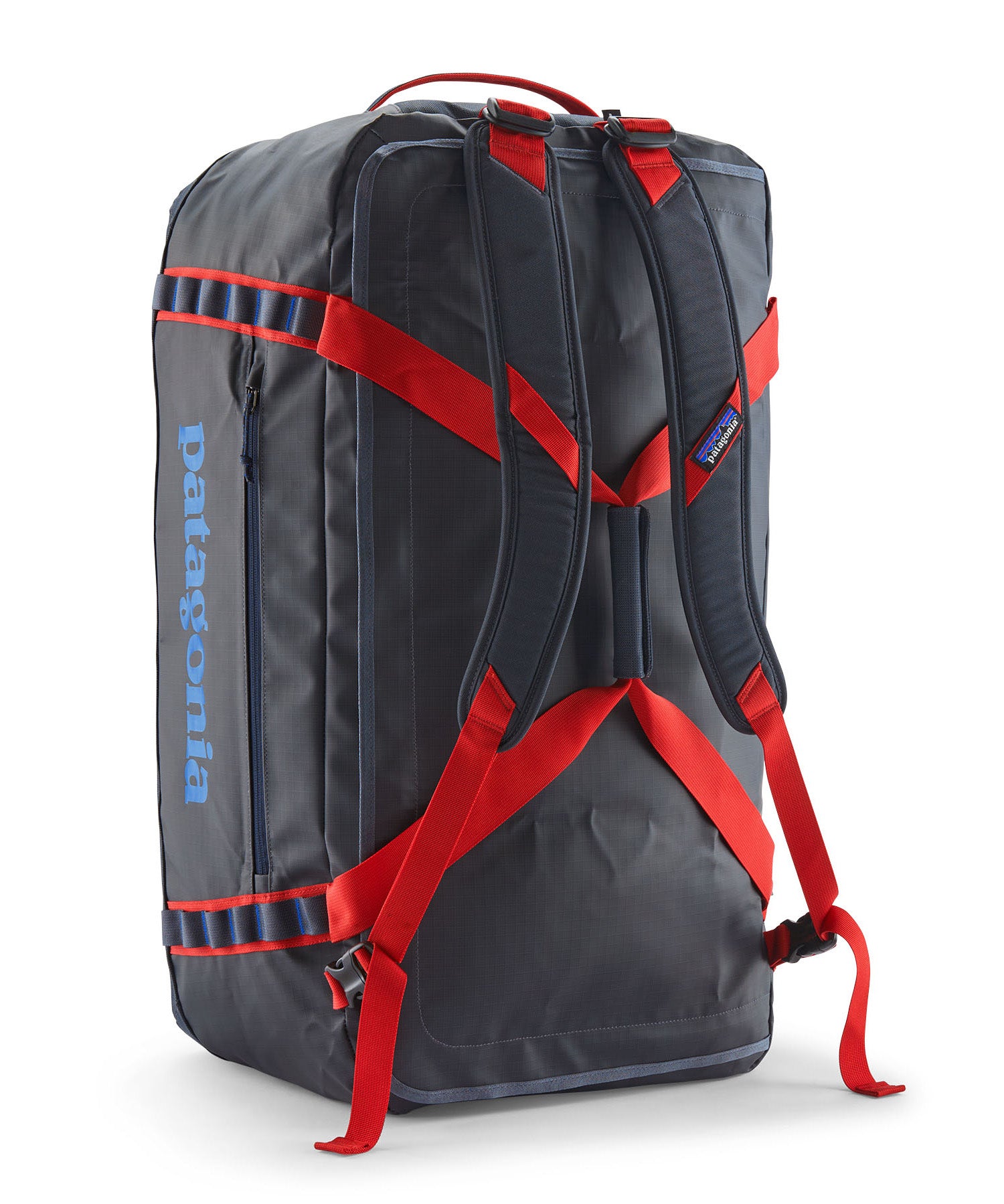 A close up of the Patagonia black hole 70L duffel bag in smolder blue / amanita red  available at Babipur showing the shoulder straps and carry straps detail