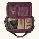 Patagonia Black Hole Duffle 40L in Berry Fig, open showing storage space and mesh zipped pocket. 