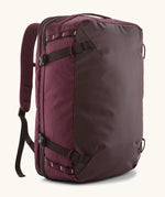Patagonia 45 litre black hole weather resistant travel backpack in maroon. Features padded shoulder pads, zipper fasteners and a carry handle