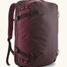 Patagonia 45 litre black hole weather resistant travel backpack in maroon. Features padded shoulder pads, zipper fasteners and a carry handle