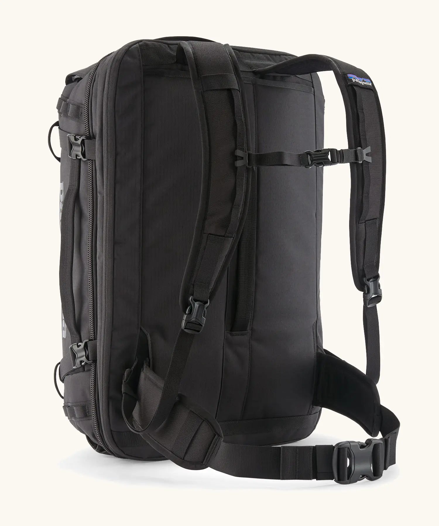 Back of Patagonia 45 litre black hole weather resistant travel backpack in all black showing padded shoulder and hip straps with buckle fasteners