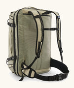 Back of Patagonia 45 litre black hole weather resistant travel backpack in beige showing padded shoulder and hip straps with buckle fasteners