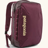 Patagonia 22 litre black hole weather resistant micro travel backpack in maroon. Features padded shoulder pads, zipper fasteners and extra loops for attaching items