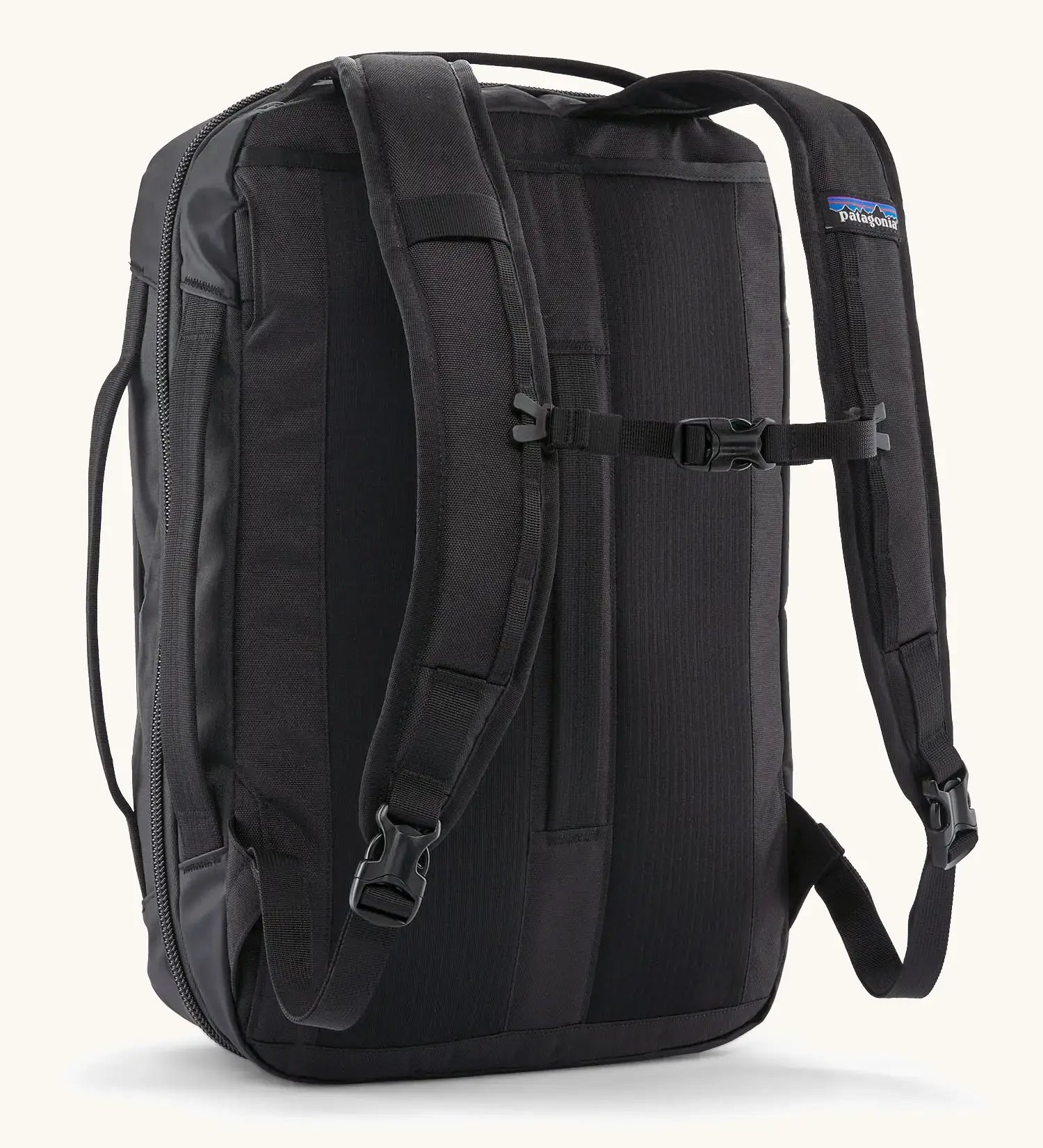 Back of Patagonia 22 litre black hole weather resistant micro travel backpack in black showing buckle fasteners on shoulder straps