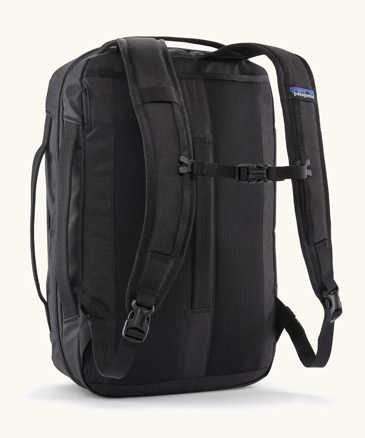 Back of Patagonia 22 litre black hole weather resistant micro travel backpack in black showing buckle fasteners on shoulder straps