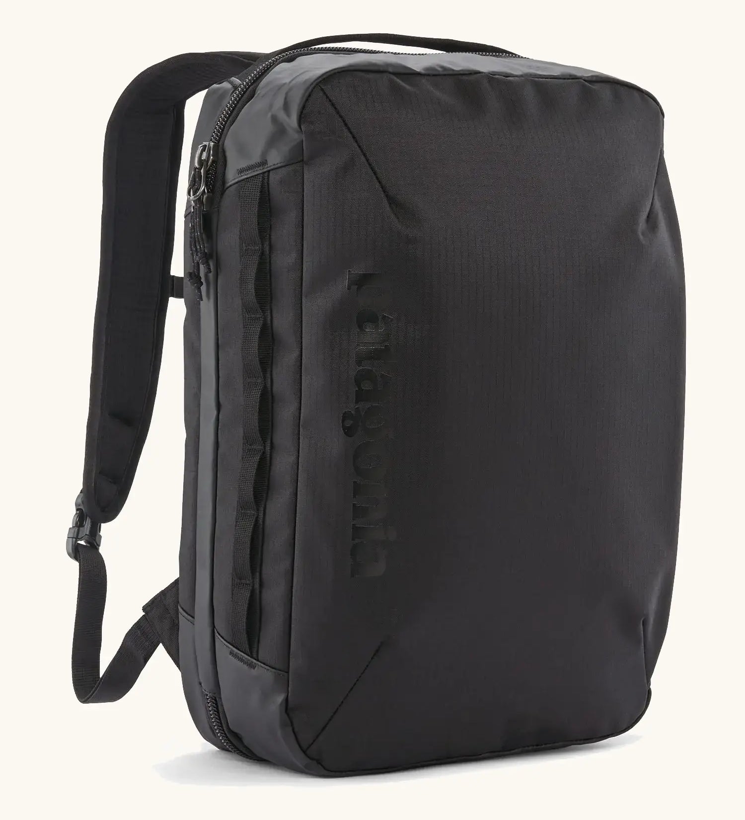 Patagonia 22 litre black hole weather resistant micro travel backpack in black. Features padded shoulder pads, zipper fasteners and extra loops for attaching items