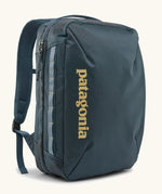 Patagonia 22 litre black hole weather resistant micro travel backpack in teal. Features padded shoulder pads, zipper fasteners and extra loops for attaching items