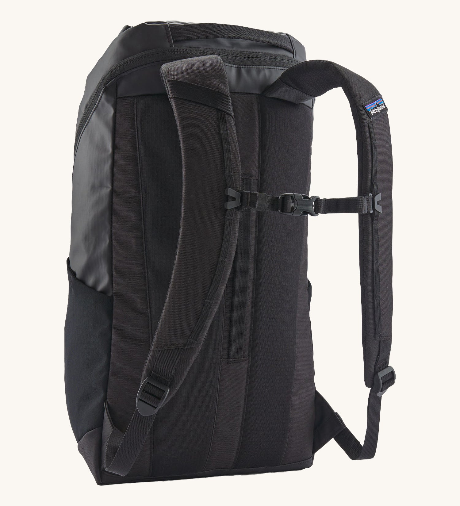 The back of the Patagonia Black Hole Backpack 25 litre capacity backpack in all black available at Babipur showing the padded shoulder straps and buckle clip detail for a secure fit.