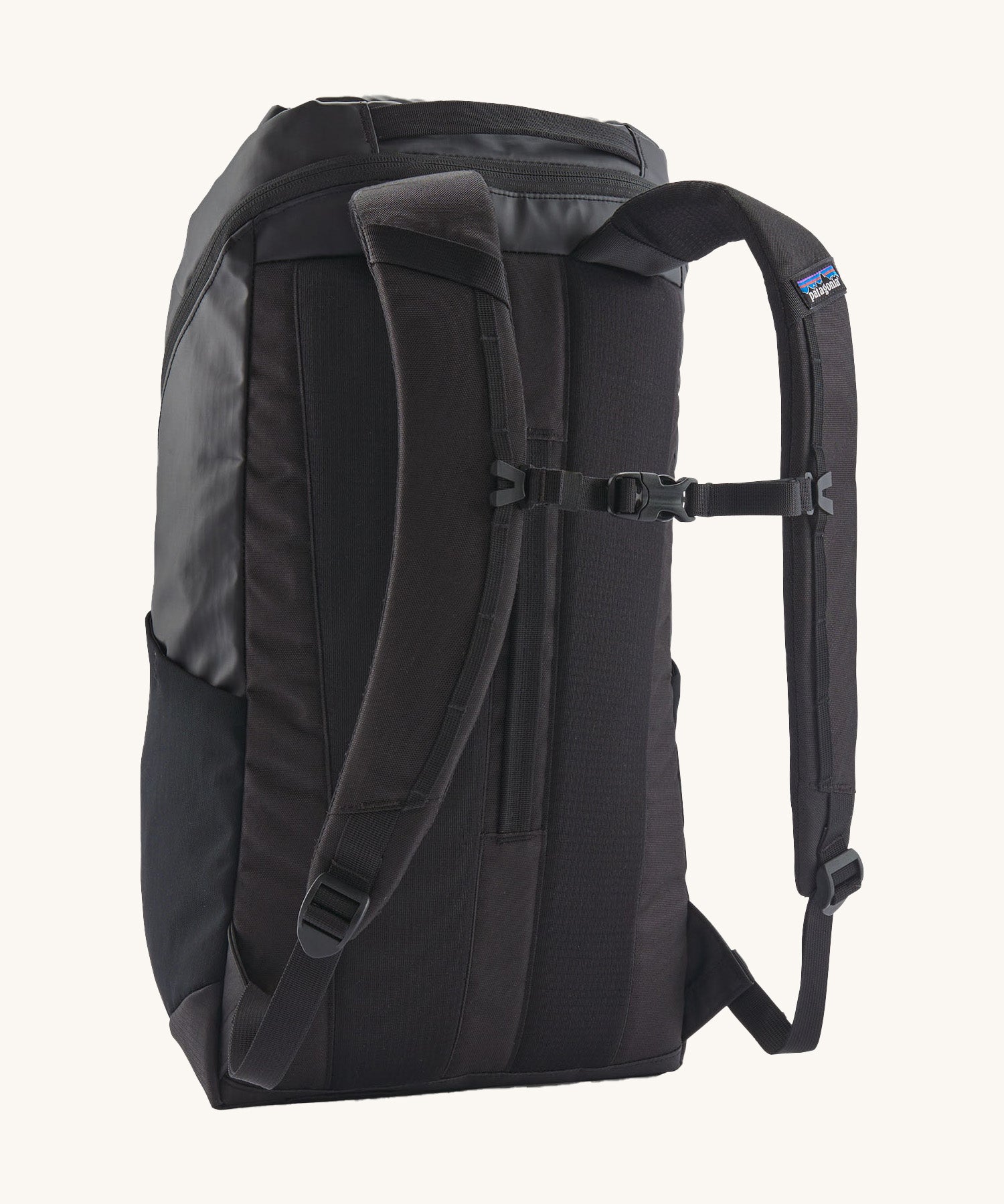The back of the Patagonia Black Hole Backpack 25 litre capacity backpack in all black available at Babipur showing the padded shoulder straps and buckle clip detail for a secure fit.