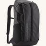 A Patagonia Black Hole Backpack 25 litre capacity backpack in all black available at Babipur. This backpack features a main zipped compartment, a compartment on the top and meshed side pockets.