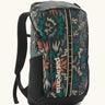 Patagonia black hole backpack 25L in black with repeating abstract pattern design. Shows zipped compartment and mesh side pocket