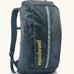Patagonia 100% recycled polyester black hole 25 litre backpack in teal. Features padded shoulder straps, top compartment and mesh side pockets