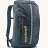 Patagonia 100% recycled polyester black hole 25 litre backpack in teal. Features padded shoulder straps, top compartment and mesh side pockets
