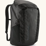 Patagonia 100% recycled polyester black hole 32 litre backpack in all black. Features padded shoulder straps, top compartment and mesh side pockets