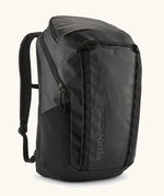 Patagonia 100% recycled polyester black hole 32 litre backpack in all black. Features padded shoulder straps, top compartment and mesh side pockets