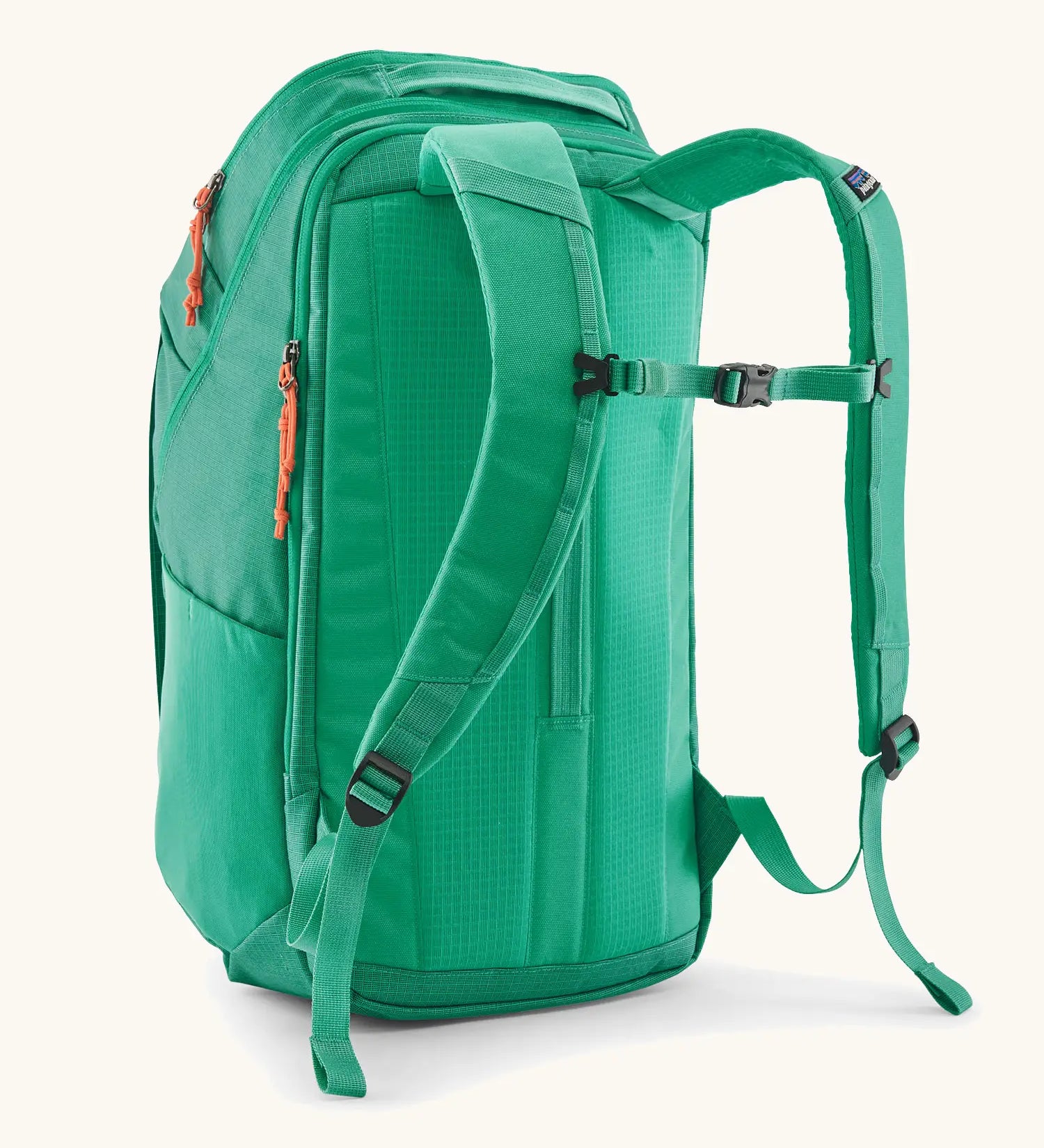 Patagonia black hole backpack 32L in bright green with matching shoulder straps and black quick release buckle