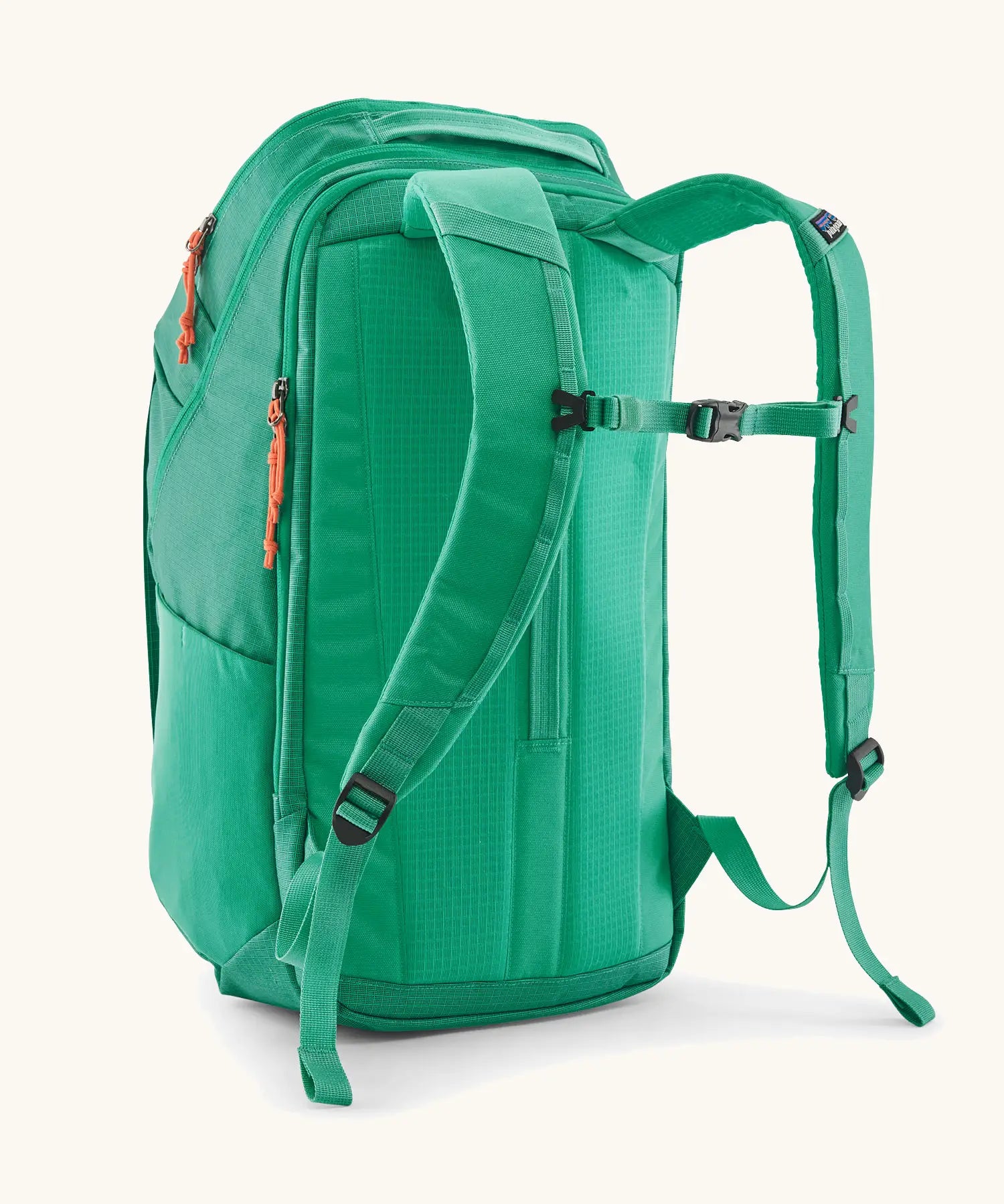 Patagonia black hole backpack 32L in bright green with matching shoulder straps and black quick release buckle