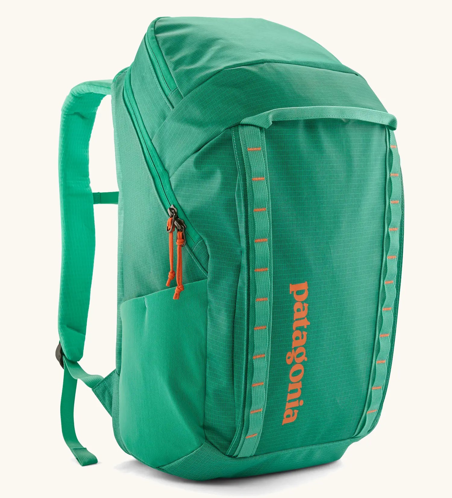 Patagonia black hole backpack 32L in bright green with zipped compartment and mesh side pocket