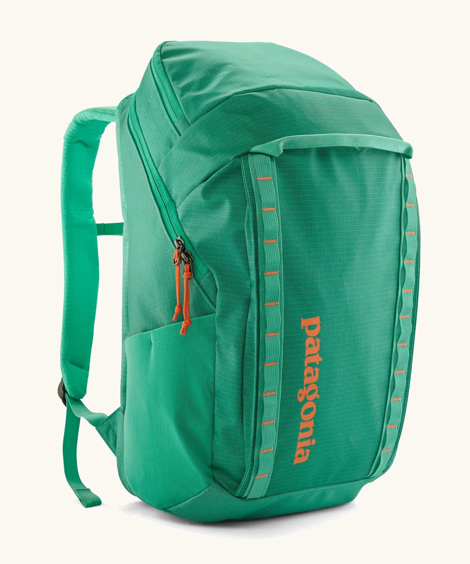 Patagonia black hole backpack 32L in bright green with zipped compartment and mesh side pocket