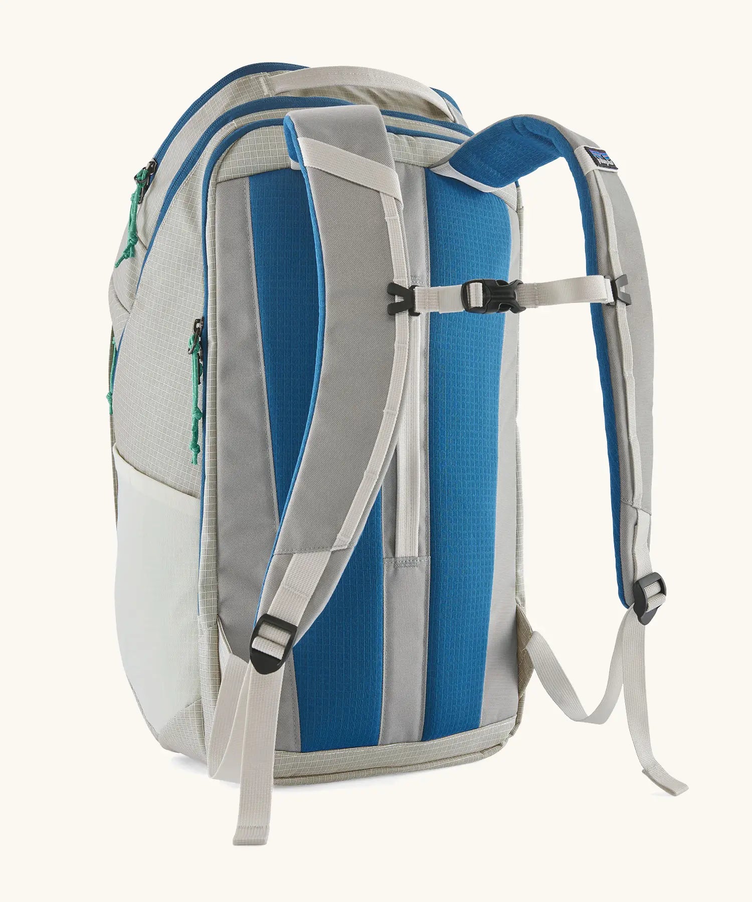 Back of Patagonia black hole backpack 32L in light grey and blue trim 