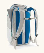Patagonia black hole backpack 32L in light grey and blue trim with showing laptop out of back compartment
