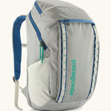 Patagonia black hole backpack 32L in light grey and blue trim with zipped compartment and mesh side pocket