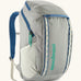 Patagonia black hole backpack 32L in light grey and blue trim with zipped compartment and mesh side pocket