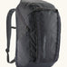 Patagonia 100% recycled polyester black hole 32 litre backpack in dark blue. Features padded shoulder straps, top compartment and mesh side pockets
