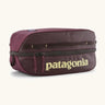 Patagonia black hole 6 litre cube bag in maroon with a double zip fastener showing the brand print on front panel
