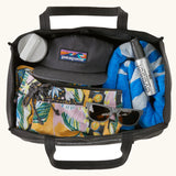 An open Patagonia weather resistant packable black hole 25 litre tote bag in black showing clothing items inside