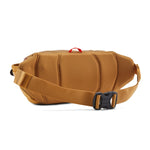  patagonia waist pack in talon gold available at Babipur. showing the padded back panel and buckle fastener detail on the strap
