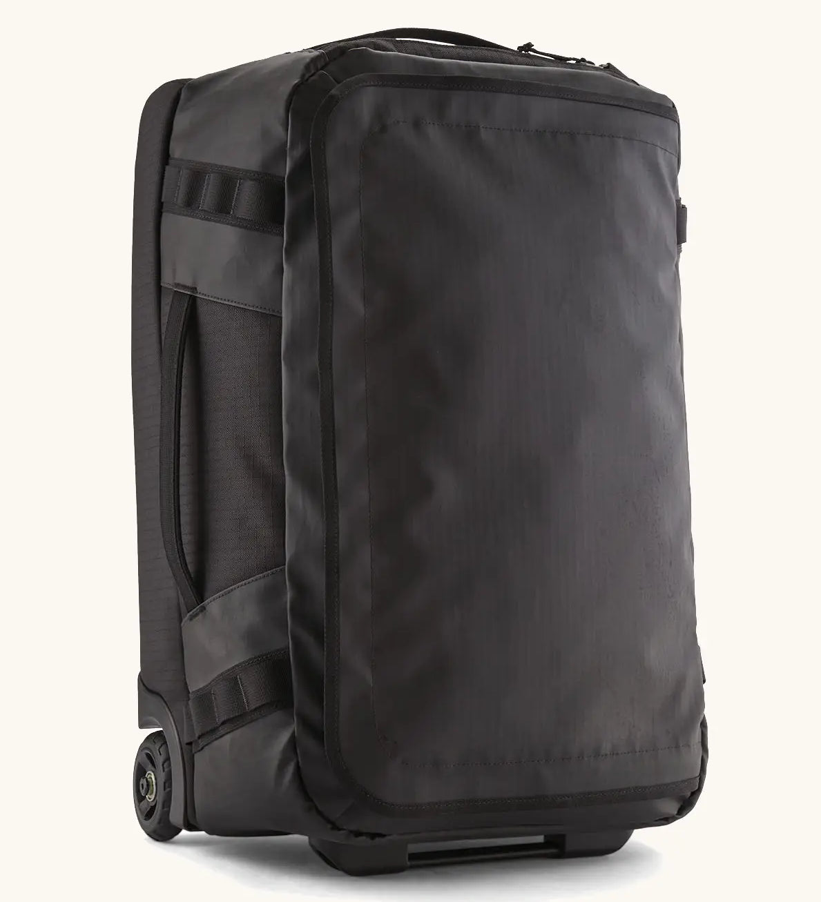 Patagonia 40 litres black hole wheeled duffel bag in all black. Features extra loops on the side for attaching small items, carry straps and retractable handle