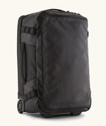 Patagonia 40 litres black hole wheeled duffel bag in all black. Features extra loops on the side for attaching small items, carry straps and retractable handle