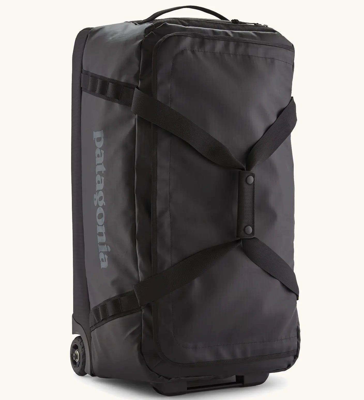 Patagonia black hole 70 litre wheeled duffel bag in black. Features extra loops on the side for attaching small items, carry straps and retractable handle