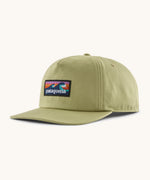 Patagonia boardshort label funfarer cap in light green with wave logo patch on front panel.