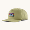 Patagonia boardshort label funfarer cap in light green with wave logo patch on front panel.