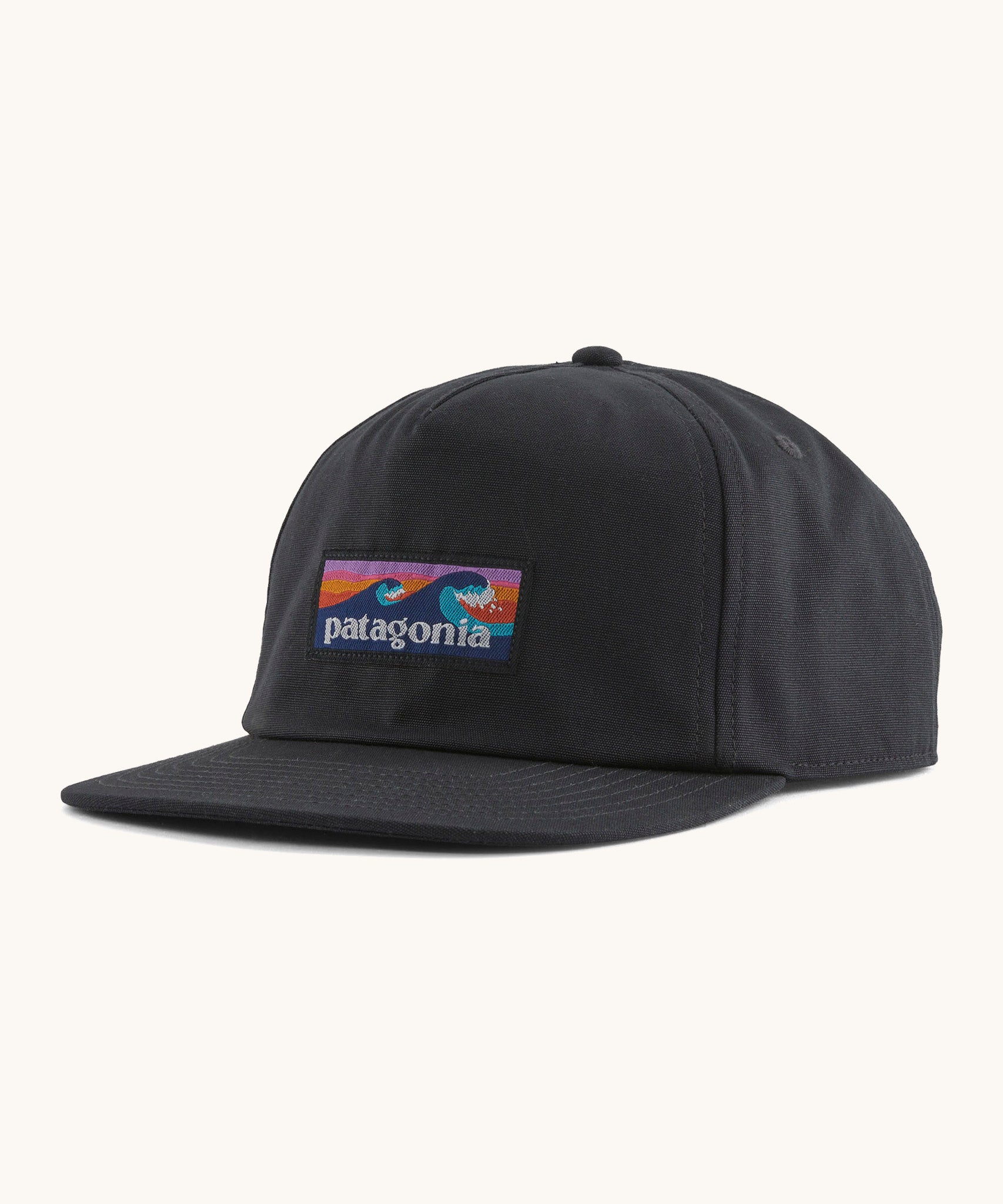 Patagonia boardshort label funfarer cap in black with wave logo patch on front panel.