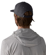 Man wearing Patagonia's boardshort label funfarer cap in black showing adjustable strap on the back. Cap has a relaxed fit and sits above the ears