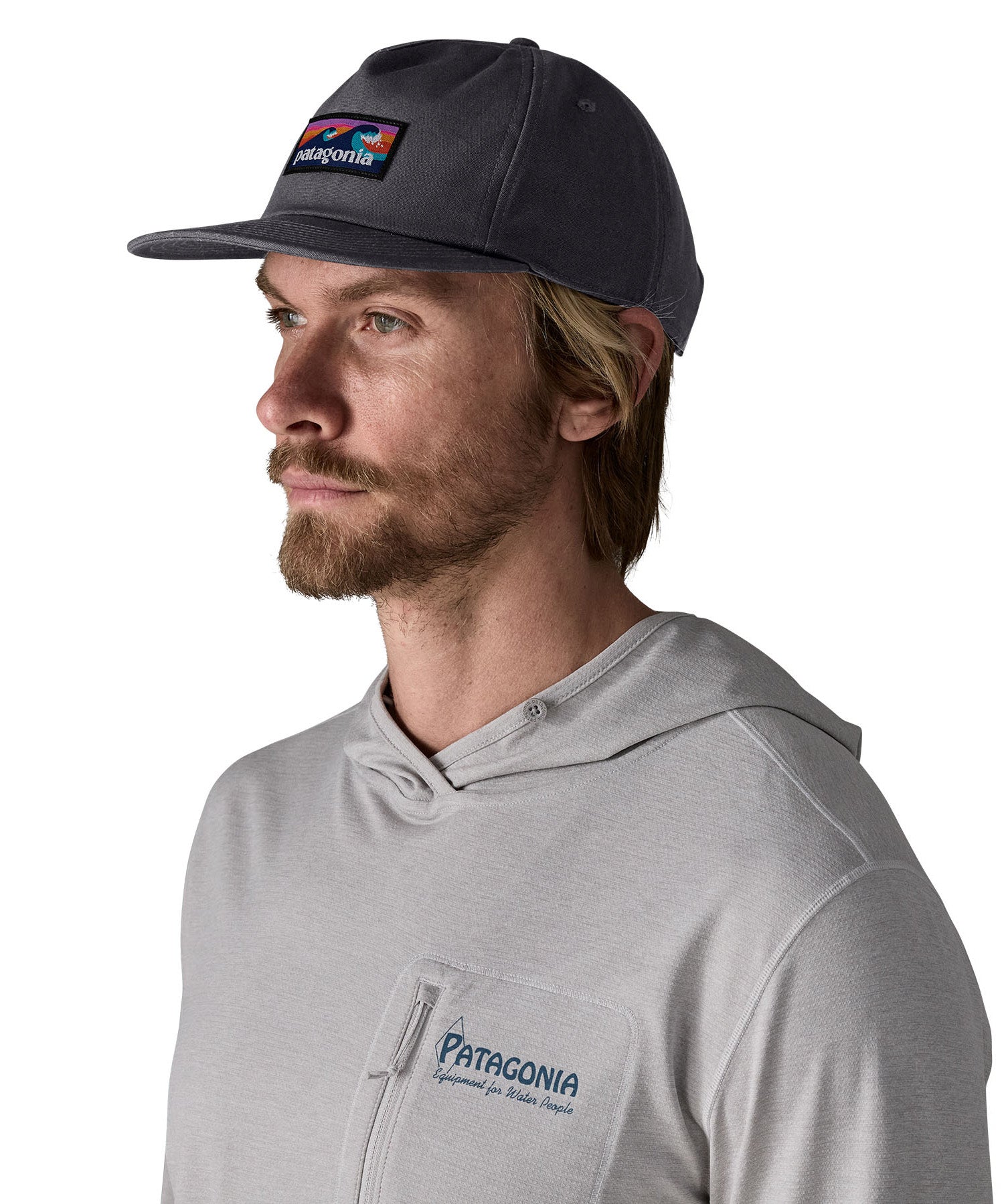 Man wearing Patagonia's boardshort label funfarer cap in black. Cap has a relaxed fit and sits above the ears
