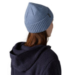 The back of a woman wearing the Patagonia adult brodeo beanie hat on barnacle blue available at Babipur.