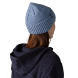 The back of a woman wearing the Patagonia adult brodeo beanie hat on barnacle blue available at Babipur.