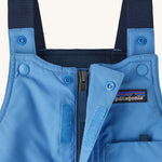 A closer look at the Patagonia Baby Snow Pile Bibs Zip Up Wind flap and shoulder straps