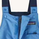 A closer look at the Patagonia Baby Snow Pile Bibs Zip Up Wind flap and shoulder straps