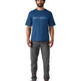 A man wearing the Patagonia capilene cool daily graphic tshirt in clement blue available at Babipur