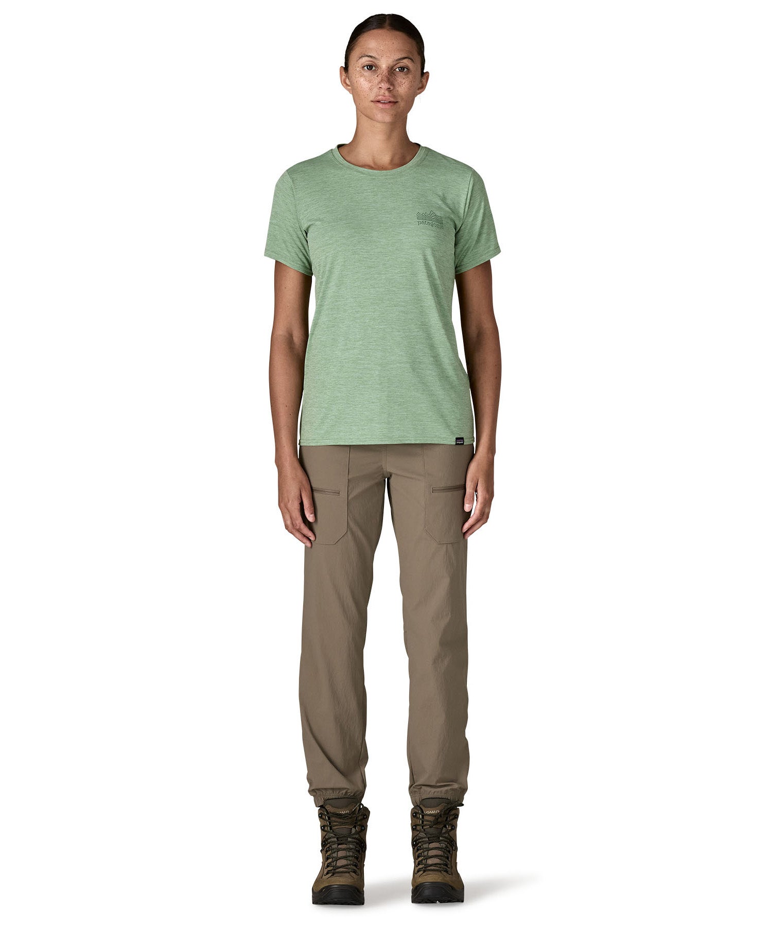 A woman wearing the Patagonia cool daily graphic short sleeve tshirt in ellwood green available at Babipur.