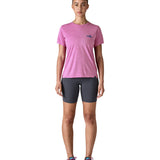 A woman wearing the Patagonia capilene cool daily graphic tshirt in 73 skyline brisk purple available at Babipur.