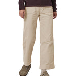 A person wearing the Patagonia Women's Wide Leg Cord Pants - Pumice, showing the flared style cut of the trouser legs