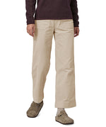 A person wearing the Patagonia Women's Wide Leg Cord Pants - Pumice, showing the flared style cut of the trouser legs